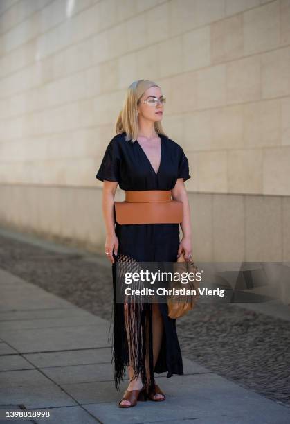 Amelie Stanescu is seen wearing Linen tunic Zara, Belt Loewe, sunglasses Dior, Bag Gia Studios, Shoes Prada, Headscarf InWear, Bag Mango on May 22,...