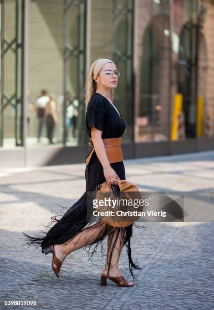 Amelie Stanescu is seen wearing Linen tunic Zara, Belt Loewe, sunglasses Dior, Bag Gia Studios, Shoes Prada, Headscarf InWear, Bag Mango on May 22,...