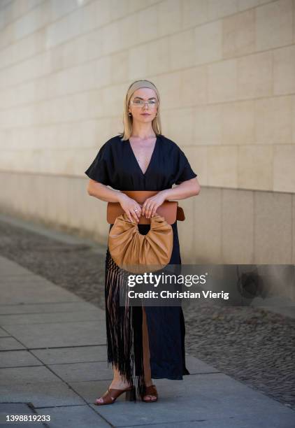 Amelie Stanescu is seen wearing Linen tunic Zara, Belt Loewe, sunglasses Dior, Bag Gia Studios, Shoes Prada, Headscarf InWear, Bag Mango on May 22,...