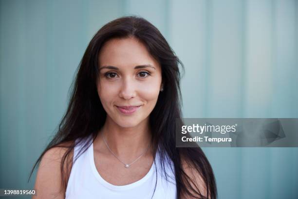 beautiful woman's headshot portrait looking at the camera. - black hair stock pictures, royalty-free photos & images