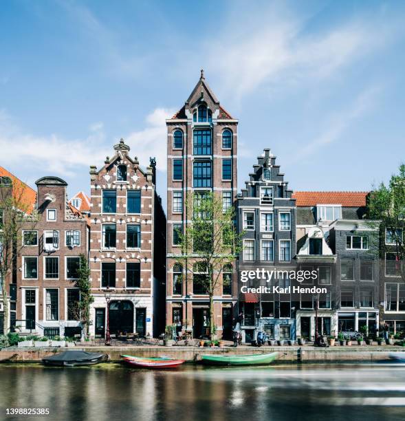 a surface level view of amsterdam - amsterdam canal houses stock pictures, royalty-free photos & images