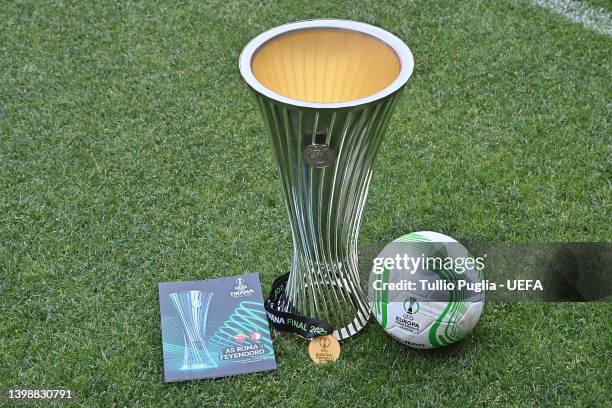 The UEFA Europa Conference League Trophy, Winner Medal, Molten Official Match Ball and Official Match Program are seen at the Arena Kombetare on May...