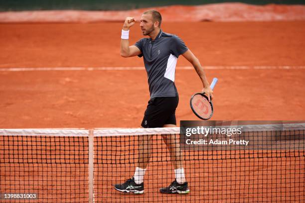 Daniel Evans of Great Britain celebrates against Francisco Cerundolo of Argentina during the Men's Singles First Round match on Day 2 of The 2022...