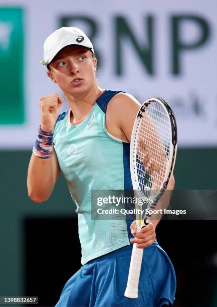 Iga Swiatek of Poland celebrates a point against Lesia Tsurenko of Ukraine in their Women's Singles First Round match during day two of the 2022...