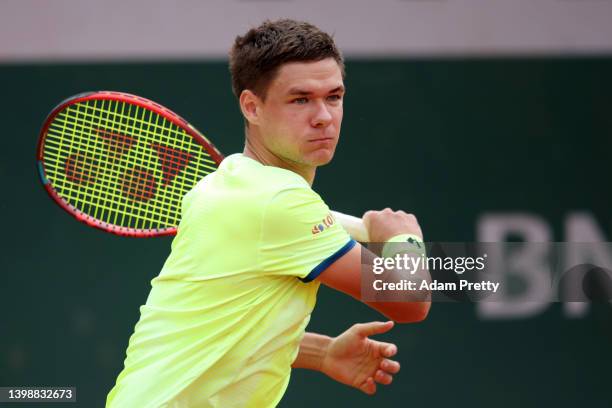 Kamil Majchrzak of Poland plays a forehand against Brandon Nakashima of United States during the Men's Singles First Round match on Day 2 of The 2022...