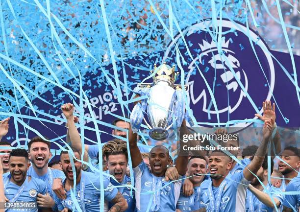 Manchester City captain Fernandinho lifts the Premier League Trophy and celebrates with the squad after the Premier League match between Manchester...