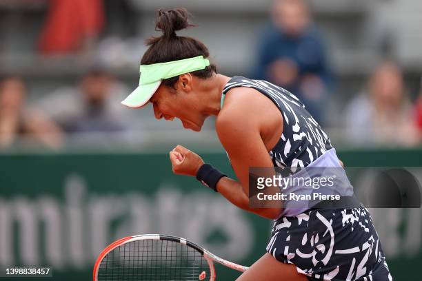 Heather Watson of Great Britain celebrates against Elsa Jacquemot of France during the Women's Singles First Round match on Day 2 of The 2022 French...