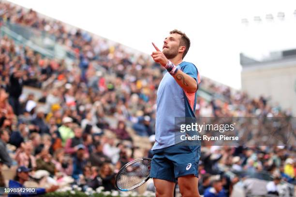 Corentin Moutet of France celebrates winning match point against Stan Wawrinka of Switzerland during the Men's Singles First Round match on Day 2 of...