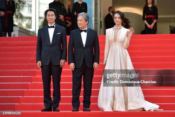 Go Kyung-Pyo, Director Park Chan-wook and Tang Wei attend the screening of "Decision To Leave " during the 75th annual Cannes film festival at Palais...