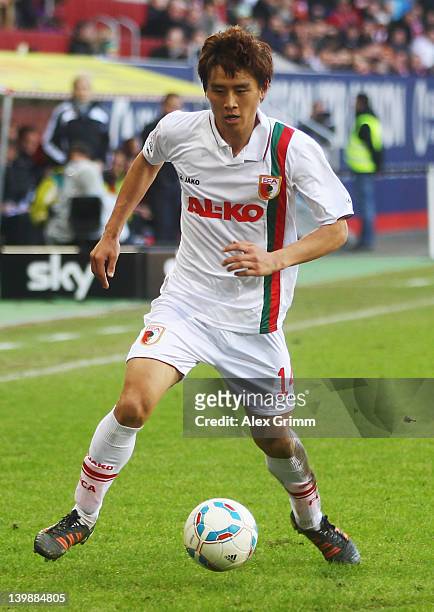 Hajime Hosogai of Augsburg controles the ball during the Bundesliga match between FC Augsburg and Hertha BSC Berlin at SGL Arena on February 25, 2012...