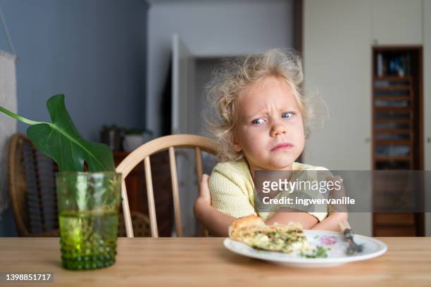 determined girl refusing to eat lunch - picky eater stock pictures, royalty-free photos & images