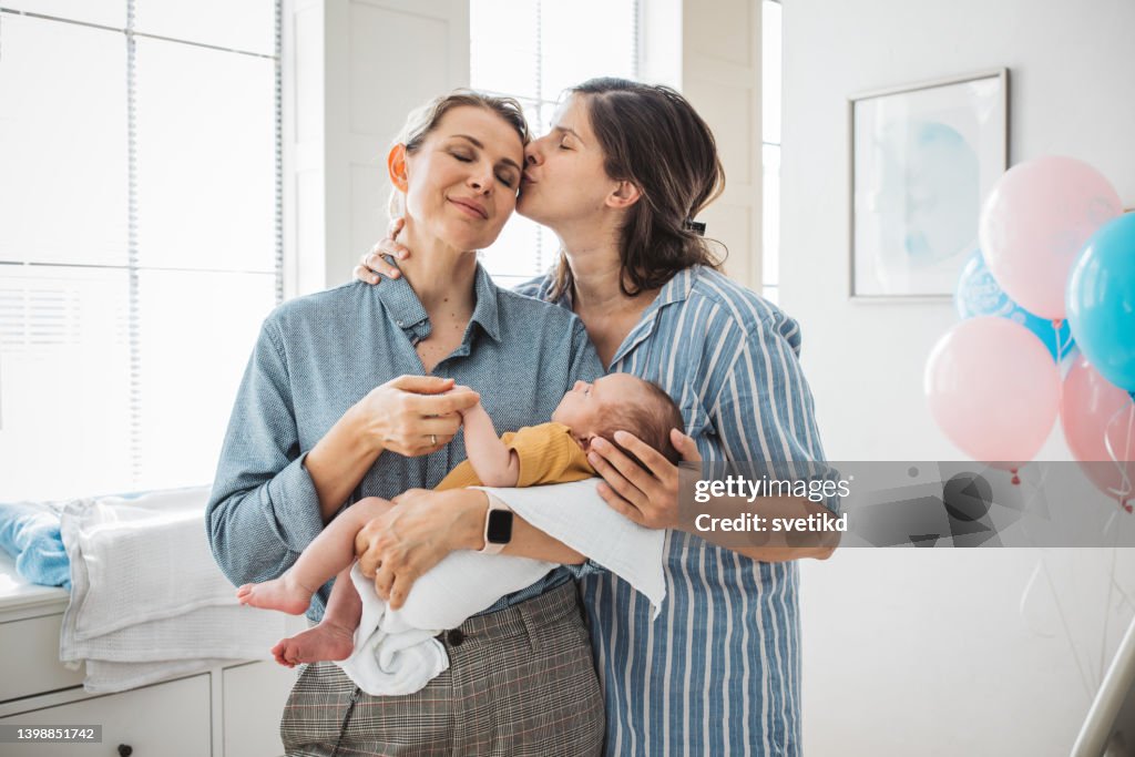 Female gay couple with newborn baby