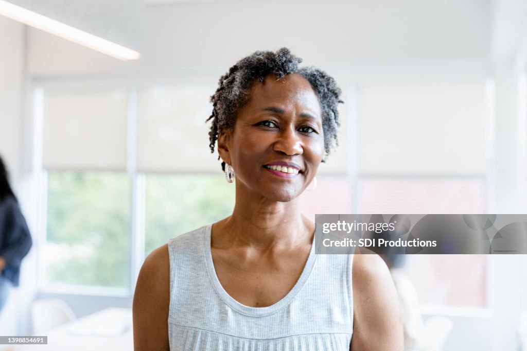 Mature female entrepreneur poses for photo