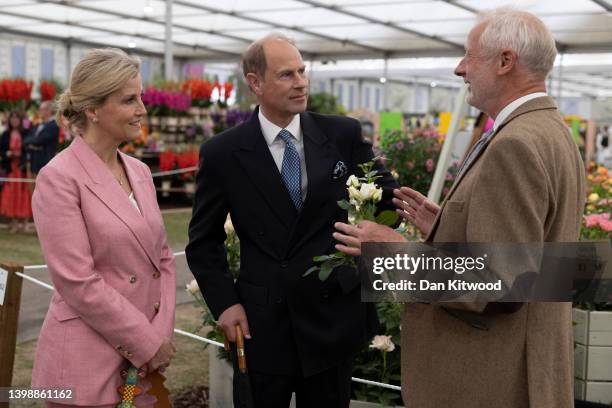 Sophie, Countess of Wessex and Prince Edward, Earl of Wessex are shown the Ystumllyn rose on the 'Harkness Roses' stand on May 23, 2022 in London,...