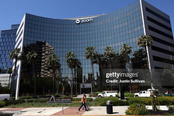 Pedestrians walk by the Zoom Video Communications headquarters on May 23, 2022 in San Jose, California. Online video conferencing company Zoom Video...