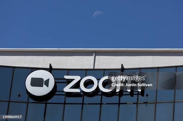 The moon sets behind the Zoom Video Communications headquarters on May 23, 2022 in San Jose, California. Online video conferencing company Zoom Video...