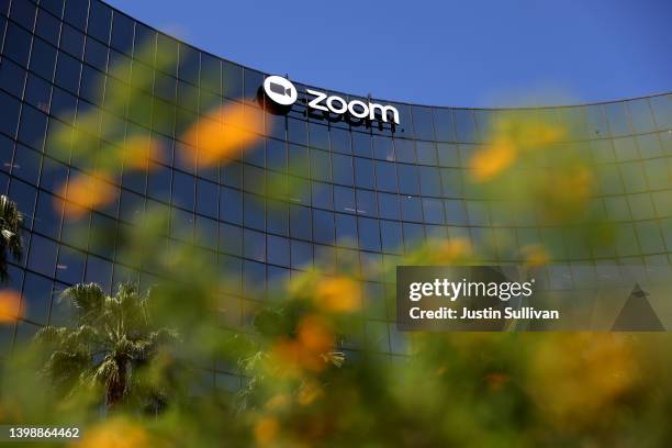 Sign is posted on the exterior of the Zoom Video Communications headquarters on May 23, 2022 in San Jose, California. Online video conferencing...