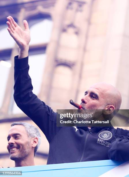 Pep Guardiola, Manager of Manchester City acknowledges the fans during the Manchester City FC Victory Parade on May 23, 2022 in Manchester, England.