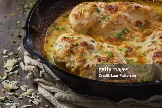 creamy baked parmesan chicken - cheese sauce stock pictures, royalty-free photos & images