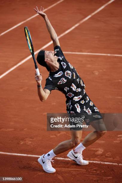 Marton Fucsovics of Hungary serves against Geoffrey Blancaneaux of France during the Men's Singles First Round match on Day 2 of The 2022 French Open...
