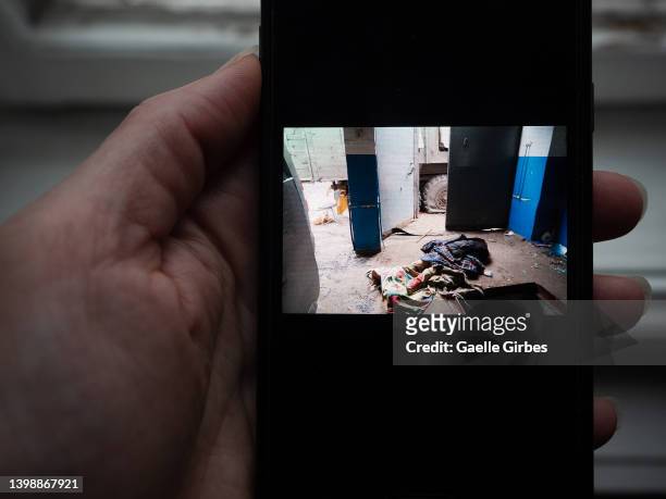 Alina, a young local journalist, took pictures with her cell phone of a civilian man she found tortured to death, his teeth pulled out, in a garage...
