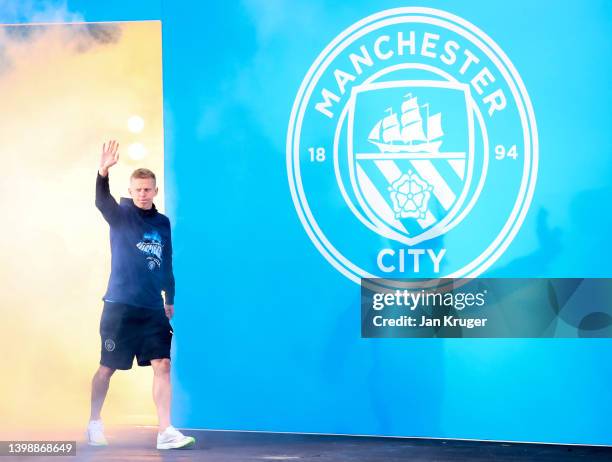 Oleksandr Zinchenko of Manchester City acknowledges the fans during the Manchester City FC Victory Parade on May 23, 2022 in Manchester, England.