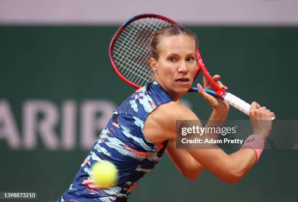Viktorija Golubic of Switzerland plays a backhand against Katie Volynets of United States during the Women's Singles First Round match on Day 2 of...