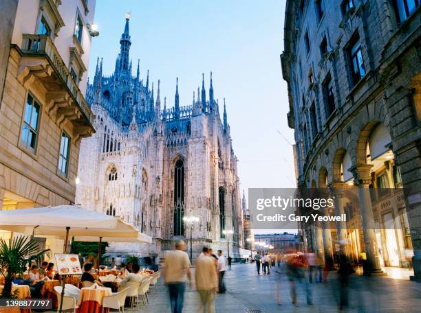 busy piazza del duomo in milan - milan night stock pictures, royalty-free photos & images