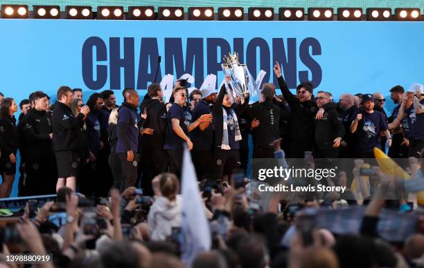 Phil Foden of Manchester City lifts the Premier League trophy during the Manchester City FC Victory Parade on May 23, 2022 in Manchester, England.