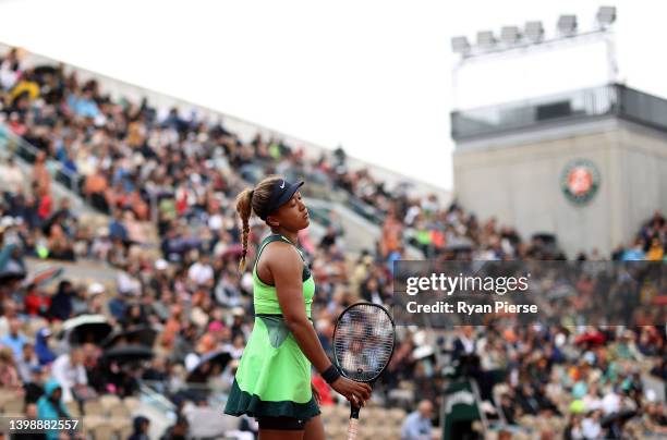 Naomi Osaka of Japan reacts against Amanda Anisimova of USA during the Women's Singles First Round match on Day 2 of The 2022 French Open at Roland...