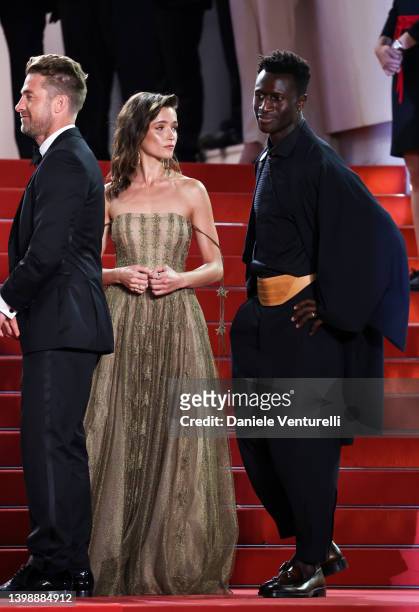 Scott Speedman, Lihi Kornowski and Welket Bungué attend the screening of "Crimes Of The Future" during the 75th annual Cannes film festival at Palais...