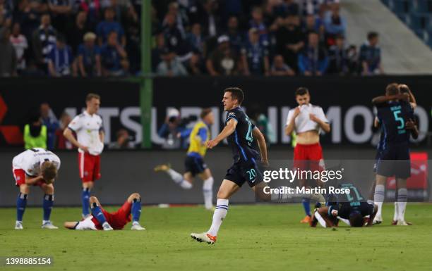 Marc Oliver Kempf of Hertha Berlin celebrates their team's victory at full-time after the Bundesliga Playoffs Leg Two match between Hamburger SV and...