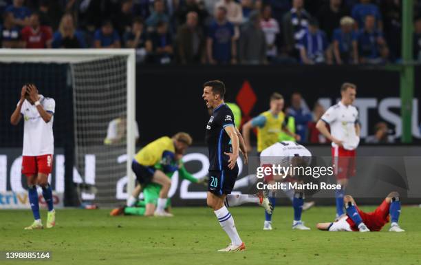 Marc Oliver Kempf of Hertha Berlin celebrates their team's victory at full-time after the Bundesliga Playoffs Leg Two match between Hamburger SV and...