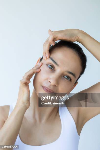 face yoga - no make up stock pictures, royalty-free photos & images