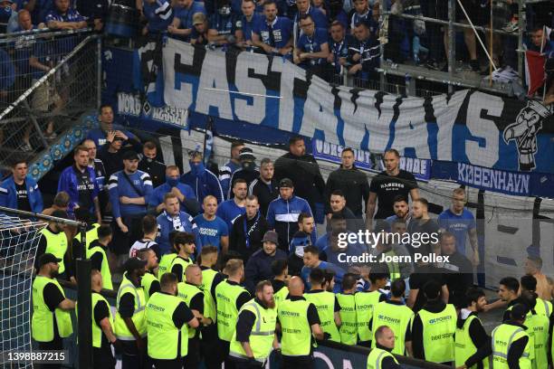 Fans of Hamburg SV talk with security staff at full-time after the Bundesliga Playoffs Leg Two match between Hamburger SV and Hertha BSC at...