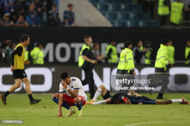 Robert Glatzel of Hamburger SV looks dejected at full-time after their team's defeat during the Bundesliga Playoffs Leg Two match between Hamburger...