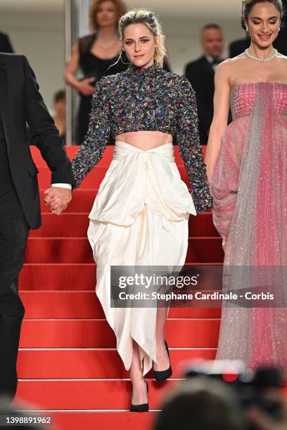 Kristen Stewart and Denise Capezza depart the screening of "Crimes Of The Future" during the 75th annual Cannes film festival at Palais des Festivals...