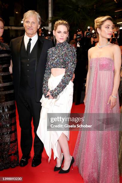 Viggo Mortensen, Kristen Stewart and Denise Capezza depart the screening of "Crimes Of The Future" during the 75th annual Cannes film festival at...