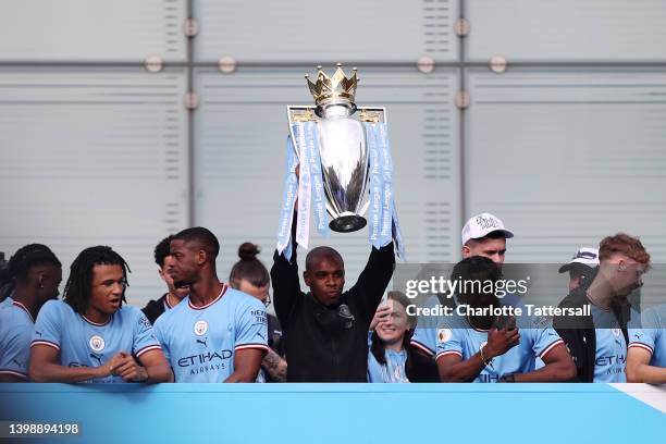 Fernandinho of Manchester City lifts the Premier League trophy during the Manchester City FC Victory Parade on May 23, 2022 in Manchester, England.