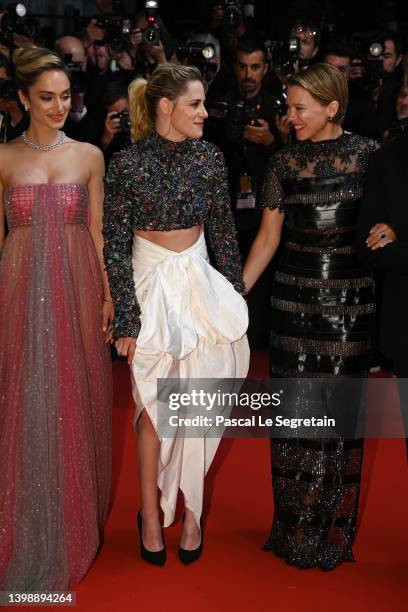 Denise Capezza, Kristen Stewart and Léa Seydoux depart the screening of "Crimes Of The Future" during the 75th annual Cannes film festival at Palais...