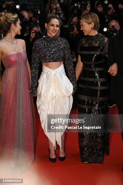 Denise Capezza, Kristen Stewart and Léa Seydoux depart the screening of "Crimes Of The Future" during the 75th annual Cannes film festival at Palais...