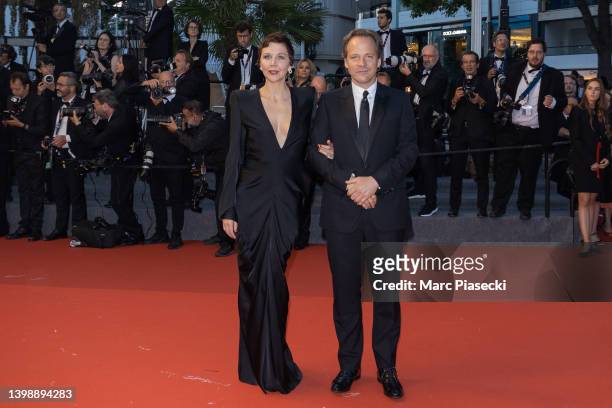 Maggie Gyllenhaal and husband Peter Sarsgaard attend the screening of "Crimes Of The Future" during the 75th annual Cannes film festival at Palais...