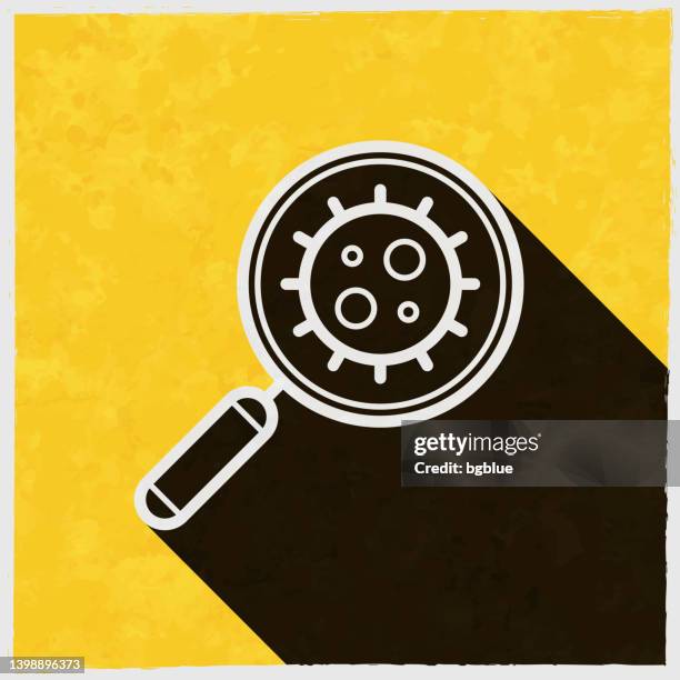 magnifying glass coronavirus. icon with long shadow on textured yellow background - medical research paper stock illustrations