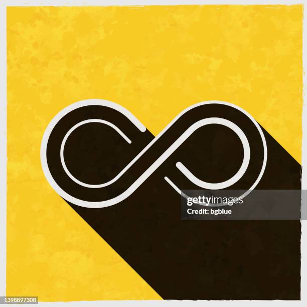 infinity. icon with long shadow on textured yellow background - infinity symbol editable stock illustrations