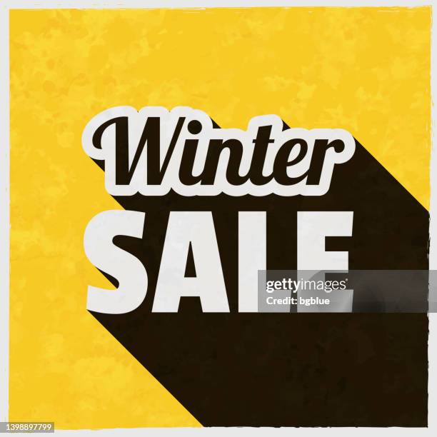 winterschlussverkauf. symbol mit langem schatten auf strukturiertem gelbem hintergrund - january holiday sale stock-grafiken, -clipart, -cartoons und -symbole