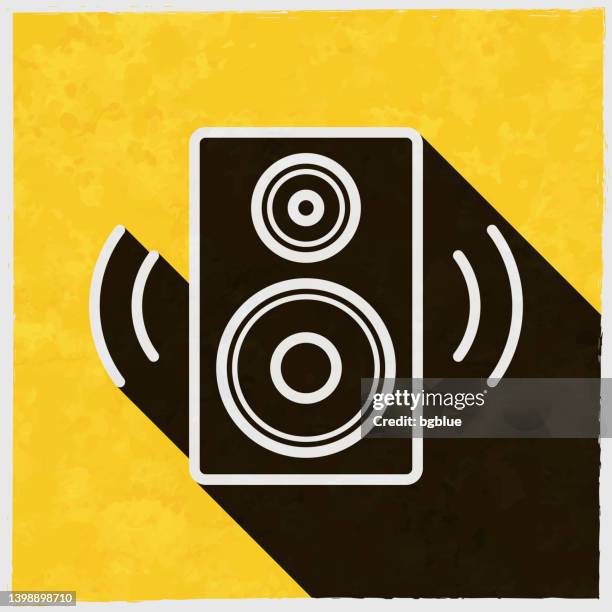 speaker. icon with long shadow on textured yellow background - yellow studio background stock illustrations