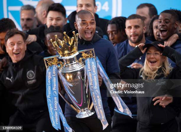 Fernandinho of Manchester City with the Premier LEague trophy during the Manchester City FC Victory Parade on May 23, 2022 in Manchester, England.