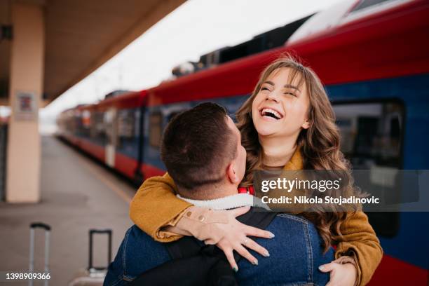 long distance relationship, couple at train station - long distance relationship stockfoto's en -beelden