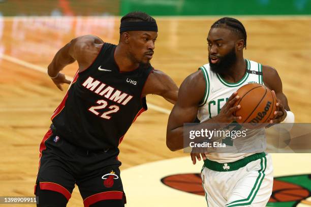 Jaylen Brown of the Boston Celtics looks to pass against Jimmy Butler of the Miami Heat during the first quarter in Game Four of the 2022 NBA...