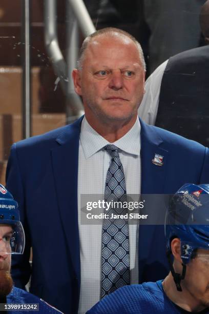 Head coach Gerard Gallant of the New York Rangers looks on from the bench against the Carolina Hurricanes in Game Three of the Second Round of the...